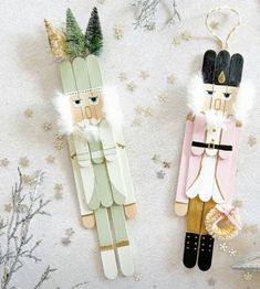 two wooden nutcrackers sitting next to each other