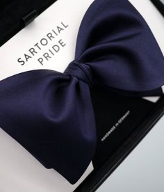 An Understated Classy Look
Want something simple yet classy at the same time? You know, a one bow tie that will give you that polished look in both formal and casual events? If that sounds like you, then look no further than this classic dark blue bow tie. Handmade by true artisans, this piece of fashion statement is made from 100% silk, giving it a subtle sheen and luster. Plan Board, Dark Blue Suit, Blue Bow Tie, Classic Accessories, Silk Bow Ties, Wedding Plan, Leather Box, Blue Bow, How To Look Classy