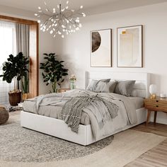 a bedroom with a large bed and plants on the wall next to the window in front of it