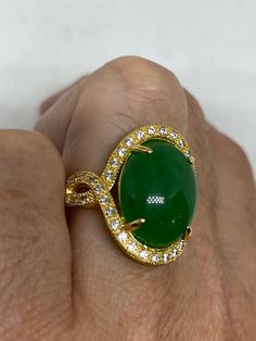 Vintage Lucky Green Nephrite Jade ring Fun jade is color enhanced Large green nephrite jade Ornate German Gold finished Vintage ring, does not tarnish, NOT sterling Size 6, 7, 8, or 8.75 All rings are shipped free in the US in a nice gift box. Check out our over a THOUSAND great reviews Engraving is $4 per letter and is not always perfect depending on the piece. It can take a few days if the jeweler is busy. This is payable to Paypal Judithsltd@gmail.com Fine Jewelry Green Oval Cabochon Rings, Green Cabochon Fine Jewelry Rings, Green Cabochon Rings Fine Jewelry, Oval Jade Rings Hallmarked, Green Jewelry With Stone Setting, Green Oval Cabochon Ring For Anniversary, Green Jade Round Stone Jewelry, Fine Jewelry Jade Oval Ring, Green Jade Jewelry With Round Stone