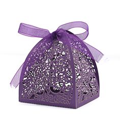 a purple gift box with a bow on the top and an intricate cut out design