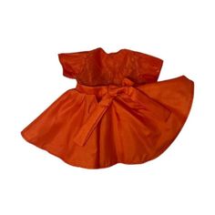 A vibrant orange party dress for dolls with a taste for distinctive fashion. Dress is synthetic silk with a lace overlay on the bodice and sleeves. Handmade dress features a full circular skirt with a bow at the side. Shown on 18 inch girl dolls, this fits Our Generation American Girl My Life dolls. This listing is for one doll dress, the doll is not included. "A vibrant citrus-hued party frock tailored for dolls with a taste for distinctive fashion." Formal Orange Satin Dress, Red Lace Trim Dress For Dress-up, Red Dress With Lace Trim For Dress-up, Formal Orange Ruffled Dresses, Formal Orange Dresses With Ruffles, Formal Orange Dress With Ruffles, Orange Ruffled Dress For Dress-up, Orange Ruffled Dress For Dress-up Occasions, Orange Ruffled Dress For Wedding