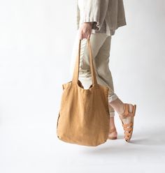 This tote bag is roomy enough for your day's carry, shopping, market, school, college, university, beach, sport, travel, yoga. This shoulder bag is made of softened Lithuanian natural linen in brown (amber) color. ❤ AVAILABLE SIZES: (tall x wide) * 15.7 x 15.4 inches (40 x 39 cm) ❤ CARE: Hand or machine wash (gentle cycle) in 30-degree water. Do not bleach. Hang to dry or in drier gentle. Iron on reverse if desired. ❤ Please note actual colors may vary from the color on your screen due to monito Casual Brown Linen Bag, Brown Linen Bag For Everyday Use, Brown Linen Shoulder Bag For Daily Use, Ethically Sourced Everyday Tote Bag, Everyday Neutral Cotton Bags, Neutral Cotton Bags For Daily Use, Eco-friendly Linen Canvas Bag For Daily Use, Eco-friendly Linen Bag For Daily Use, Eco-friendly Linen Bags For Daily Use