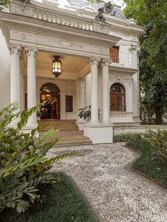 a large white house with columns and windows