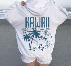 Aesthetic Hawaii Hoodie, Aloha State sweatshirt, Trendy Oversize Hoodies, Tumblr beach Hoodie, VSCO Trendy Hoodie Words on back hoodies 🖤 For oversized order 1-3 sizes up, refer to listing photos for sizes 🖤 Gildan 18500 🖤 Some Shrinkage may occur with washing This unisex heavy blend hooded sweatshirt is relaxation itself. Made with a thick blend of cotton and polyester, it feels plush, soft and warm, a perfect choice for any cold day. In the front, the spacious kangaroo pocket adds daily pra Aesthetic Hawaii, Hawaii Hoodie, Beach Hoodie, Hoodies Aesthetic, Sweatshirt Trendy, Aesthetic Hoodie, Cute Sweatshirts, Vacation Shirts, Oversize Hoodie