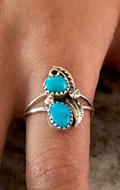 These two bright blue turquoise Sleeping Beauty gems are colorful and eye-popping. Made with sterling silver rope, one leaf, star and miniature silver drops borders the gem. Absolutely beautiful color!  Only one available, size 7.  This would make a great gift. Southwestern Blue Turquoise Teardrop Ring, Handmade Blue Turquoise Teardrop Ring, Southwestern Teardrop Blue Rings, Southwestern Blue Teardrop Ring, Handmade Turquoise Teardrop Ring, Handmade Teardrop Turquoise Ring, Southwestern Blue Jewelry For Anniversary, Blue Turquoise Teardrop Ring For Anniversary, Blue Teardrop Turquoise Anniversary Ring