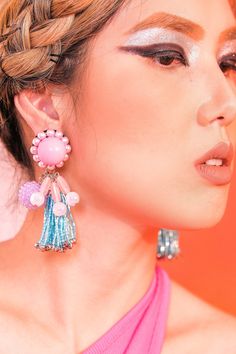 These bubbly earrings in pink and blue are so pretty, it's true. With bubblegum ball studs, and purple rhinestone candy orbs, these earrings are good enough to eat. Wear it on your birthday, or just about any holiday. You'll look oh-so-yummy everyday. The Birthday Cake tassel earrings are part of our Retro Candy Shop Collection inspired by the retro era of colorful fashion. Rewind to the nostalgic days with our eye-candy earrings in different flavors to wear with your bold print dress. A little bit of retro to your style makes the world sweeter and a little more vibrant. Glamorous Pink Jewelry For Celebration, Playful Jewelry With Matching Earrings For Party, Glamorous Pink Earrings For Celebration, Playful Pink Earrings For Party, Playful Pink Jewelry For Party, Playful Blue Jewelry For Party, Playful Pink Party Jewelry, Playful Purple Jewelry For Party, Playful Pink Beaded Earrings