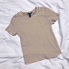 Features: 100% Cotton Fitted Short Sleeve T Shirt New With Tags (Nwt) With Banded Crew Neck Collar. Black, White, And Yellow Horizontal Stripes. Very Soft And Comfortable. Size: S Condition: Great Preowned Condition! Little To No Signs Of Wear No Flaws Follow Me @Second_act_closet On Ig!! Tags: Casual, Everyday Wear, Eras Tour, Concert, Taylor Swift, Midnights, Fearless (Taylor’s Version) Forever 21 Striped Cotton Tops, Casual Striped Tops From Forever 21, Forever 21 Yellow Cotton Top, Trendy Yellow Forever 21 Tops, Forever 21 Yellow Casual Top, Concert Taylor Swift, Light Pink Bodysuit, Ig Tags, Bodysuit With Shorts