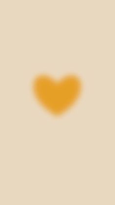 an orange heart on a beige background