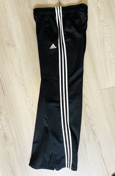 Adidas Track Pants Youth XL-18 Fleece Lined 3 Stripe Side Pockets Elastic Waist approx measurements flat lay: waist: 15" inseam: 32" fabric: polyester color: black with white stripes features: elastic waist, side pockets (L-8) Ballet Outfit, Basketball Pants, Stripes Fabric, Adidas Track Pants, Dance Clothes, Adidas Track, Jd Sports, Dance Outfits, Track Pants