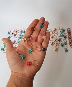 These cool braid rings are the perfect hair accessory! Perfect in short or long hair, highlighting braids, buns and ponytails. A great accessory to add with any outfit! Dress up or wear with jeans. A must-have hair accessory for the beach! SET OF 10 PCS MATERİAL 1- COOPER RİNG -EVİL EYE BEADS 2-COOPER RİNG- COLORED WOODEN BEADS 3-COOPER RİNG- STAR TURQUOİSE BEADS 4- THİCK COOPER RİNG hammered 5-COOPER RİNG- Rose plated leaf 6-COOPER RİNG-red color turkuoise star 7-COOPER RİNG- white color turkuo Heart Hair Ring, Hollow Hair Rings, Hair Rings Short, Hair Charm Rings, Hair Rings Wedding, Ring On Hair Gender, Hollow Out Hair Ring, Cute Hair Rings, Braid Rings