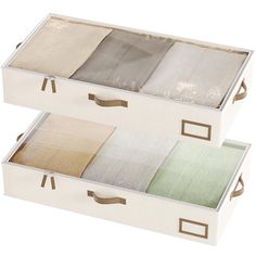 three boxes with different colored linens in each one on the bottom, and two are open