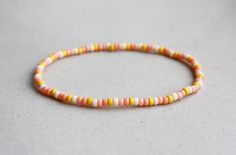 Pink & Yellow Bracelet - 3mm beads - stretchy I can make the bracelet to your size.  Just send me a message or you will receive a standard size (18cm) bracelet. Summer Jewellery, Orange Bracelet, Yellow Bracelet, Zodiac Bracelet, Christmas Bracelet, Bracelet Boho, Wish Bracelets, Boho Summer, Summer Jewelry