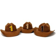 three hats with the number one on them