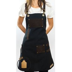 a woman is wearing an apron and posing for the camera with her hands on her hips