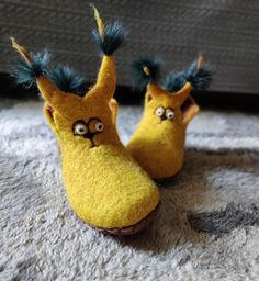 Kids slippers - felted wool slippers for children yellow squirrel - woolen booties - kids house shoes - gift for kids. Handmade felted slippers are made using all natural products -100% wool ,water and olive oil soap. Soles are covered with natural leather. Decorated with silk and natural fur. These colourful slippers are for children. SIZE: to order. The wool slippers massage your feet and give pleasure.  Shipping usually takes from 2 (EU) to 3-4 (US, Canada, Australia ) weeks. HOLIDAY SHIPPING Handmade Round Toe Slippers For Gifts, Yellow Round Toe Indoor Slippers, Soft Sole Felt Slippers With Round Toe, Yellow Slippers With Rubber Sole And Round Toe, Handmade Closed Toe Slippers As Gift, Winter Yellow Round Toe Slippers, Yellow Slip-on Slippers For Winter, Felted Wool Slippers, Squirrel Gift