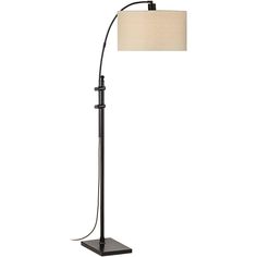 a black floor lamp with a white shade on the base and a beige fabric shade