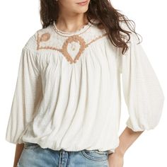 An Embroidered Front Yoke With A Mesh Overlay Delicately Defines This Seersucker Constructed Blouson Top. It Has Scoop Neck With Ruffle Trim, Long Sleeves With Elasticized Cuffs, Smocked Back Yoke, And Blouson Construction With Elasticized Hem Lined In The Bodice. Brand: Free People Material: Shell: 83% Viscose, 17% Linen Lining: 100% Viscose Cleaning: Machine Wash Color: Sand Cream Size: Medium Measurements: Bust - 38" Length - 22" Fall Embroidered Crew Neck Top, Fall Cotton Tops With Floral Embroidery, Floral Embroidered Cotton Tops For Fall, Casual Cotton Embroidered Top With Relaxed Fit, Casual Embroidered Top With Relaxed Fit For Spring, Fall Cotton Blouse With Geometric Embroidery, Casual Off White Cotton Blouse, Embroidered Blouse For Daywear In Fall, Spring Beige Embroidered Cotton Top