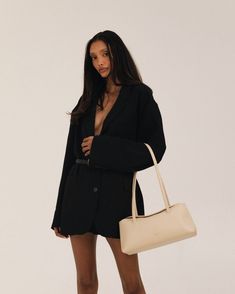 Understated, sophisticated, and unique, the Chrystie is destined to be an inevitable classic for years to come. Luxuriously soft and generously roomy, featuring 4 large interior pockets, a key clip, and hidden double magnetic folding top closure. Key Clip, Oats, New York, Key