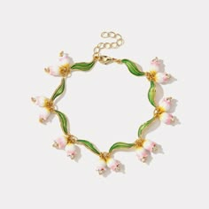 Elevate your look with our Flower Enamel Bracelet, crafted with a beautiful enamel for a luxurious touch and classic style. Lasting quality and unique design make this bracelet the perfect accessory for special occasions or everyday wear. DETAILS Plating: 18k Gold on Brass Materials:   18K Gold on Brass, Freshwater Pearl Measurements: Length: 7.48"(19.0cm) + Extender: 1.57"(4.0cm) Weight:  26.84g Kali Aesthetic, Cutesy Jewelry, Lily Of The Valley Jewelry, Pink Lily Of The Valley, Lily Of The Valley Flowers, Slouch Socks, Unique Gift Wrapping, Hand Necklace, Opal Pendant Necklace