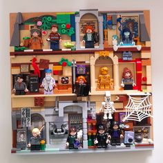 there are many legos on the shelf in this house that is made out of legos