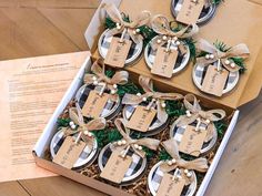 a box filled with christmas ornaments on top of a wooden table next to a menu