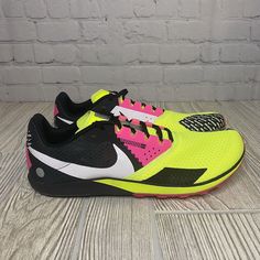 Introducing The Nike Rival Waffle 6 Cross Country Shoes In Men's Size 11. This Pair Features A Vibrant Color Combination Of Volt Hyper Pink, Making It A Great Choice For Those Who Love Colorful And Stylish Racing Footwear. The Shoes Are Designed With A Low Top Shoe Shaft Style And Lace-Up Closure For A Comfortable And Secure Fit. The Nike Waffle 6.0 Model Is A Lightweight And Breathable Sneaker That Is Perfect For Racing And Running Activities. It Is Made Of Synthetic Upper Material And Has Stan Nike Yellow Running Shoes For Trail, Nike Yellow Running Shoes For Marathon, Nike Running Shoes With Rubber Waffle Outsoles For Sports, Nike Running Shoes With Durable Outsoles For Sports, Sporty Running Shoes With Rubber Waffle Outsoles For Training, Nike Running Shoes For Training With Rubber Sole, Nike Running Shoes With Rubber Sole For Training, Yellow Running Shoes With Rubber Waffle Outsoles, Pink Sports Running Shoes With Vibram Sole