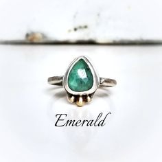 "Genuine 10mm faceted green emerald is handset in oxidized sterling silver with recycled 14k gold mixed metal accents. ~Ring with stone set is a size 7 (can be hammered to 7.25\") ~If you need a different size please choose loose stone and I will create your own custom ring ~Wrapped in black gift box ~Handmade in Tennessee" Everyday Jewelry With Bezel Setting For May Birthstone, Unique Emerald Birthstone Jewelry, Everyday Emerald Jewelry Ring, Heirloom Emerald Ring With Bezel Setting For May Birthstone, Everyday Green Emerald Ring With Bezel Setting, Everyday Emerald Birthstone Jewelry, Heirloom Emerald Ring With Bezel Setting, Faceted May Birthstone Ring Jewelry, Unique Emerald Ring With Bezel Setting Gift