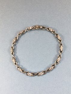 "Beautiful Sterling Silver CZ link bracelet. Lovely sparkling stones prong set . Signed 925 CII China. Classic design. Measures 7\" and has a slide safety clasp. Condition is very good. This is a beautiful bracelet and perfect for a special occasion."