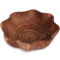 a wooden bowl sitting on top of a white surface