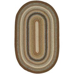 a brown and blue oval rug on a white background with an oval design in the center