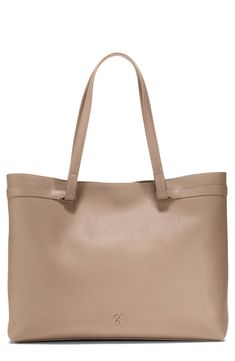 From busy workdays to quick getaways, this pebbled leather tote will become a staple with its generous size that accommodates up to a 16" laptop. Magnetic closure Shoulder straps Exterior welt pocket Interior zip, wall and smartphone pockets Fits most 16" laptops Structured silhouette with flat base for stability Lined Leather Imported Soft Leather Tote, Quick Getaway, Irish Coffee, Natural Tan, Shopper Tote, Black Tote Bag, Magnetic Closure, Cole Haan, Welt Pocket