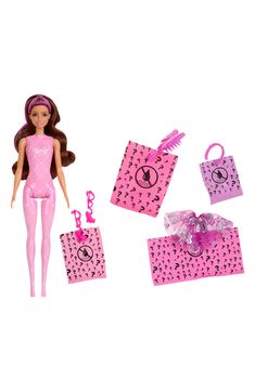 a barbie doll with pink clothes and accessories on it's head, standing next to two bags