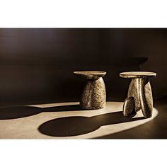 two small stools sitting next to each other