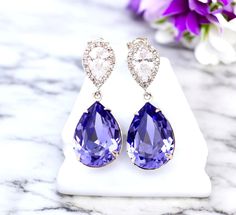 Elegant and Romantic  Tanzanite Teardrop Dangle Earrings! This shade of purple suggests refinement along with grace, elegance and something special.  I made these gorgeous Earrings with: - 18x13mm genuine Tanzanite  teardrop pear shaped fancy stones, set in sterling silver plated settings - Hypoallergenic, Rhodium plated and tarnish resistant .925 Sterling Silver pear shaped ear posts with AAA cubic zirconia stones - these are approx 1 1/4" from top of the ear posts to bottom of the stones These dazzling fancy crystals are designed with incredible facets that produce the famous  sparkle. Perfect for brides, bridesmaids and special occasions! Matching Necklace is available here: https://www.etsy.com/listing/225854945/hot-pink-necklace--crystal-rose Also available in GOLD PLATED finish: http Elegant Lavender Crystal Earrings For Wedding, Purple Teardrop Crystal Earrings For Wedding, Purple Teardrop Crystal Earrings For Formal Occasions, Lavender Crystal Earrings For Wedding, Purple Dangle Teardrop Earrings For Wedding, Lavender Drop Earrings For Formal Occasions, Purple Teardrop Earrings For Wedding, Purple Wedding Teardrop Earrings, Purple Drop Earrings For Wedding