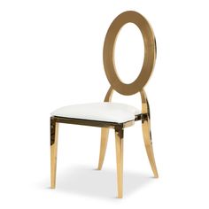 a gold and white chair with a circular back rest on it's side, against a white background