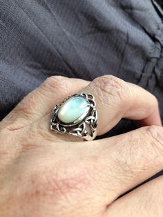 Lovely polished sterling silver has the look of white gold set with a huge white Mother Of Pearl set in very detailed vintage filigree Size 6, 7, 8 or 9 I can also have them resized by my jeweler for $10 fee. All rings are shipped in a nice gift box. Check out our over a THOUSAND great reviews Engraving is $4 per letter and is not always perfect depending on the piece. It can take a few days if the jeweler is busy. This is payable to Paypal Judithsltd@gmail.com Antique Oval Opal Ring In Sterling Silver, Classic Handmade Opal Ring, White Sterling Silver Rings Engraved, White Engraved Sterling Silver Rings, Engraved White Sterling Silver Rings, Antique Silver Oval Cabochon Ring, Silver Sterling Silver Victorian Filigree Ring, Victorian Filigree Ring In Sterling Silver, Victorian Sterling Silver Filigree Ring Stamped 925