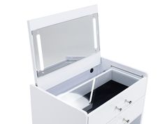 an open white vanity with mirror and drawers