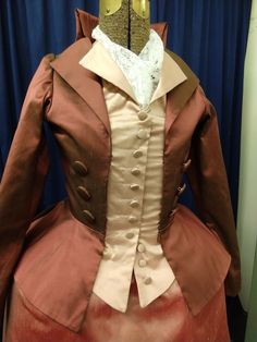 "We are unusually busy this year, so custom sizes require a THREE MONTH wait. Your costume will not be made until late October, and it will NOT ARRIVE IN TIME FOR HALLOWEEN 18th century ensemble inspired by \"Angelica\" designs in the musical \"Hamilton\". Available in many fabrics and colors. Contact us for details. We are happy to make any style/fit/fabric changes you like. The customer from these photos wanted to reuse the rose colored skirt from her other Angelica dress, so the fabric draped Fitted Victorian Dress Costume, Elegant Fitted Victorian Dress For Fancy Dress, Fitted Victorian Historical Dress, Fitted Regency Victorian Dress For Costume Party, Victorian Fitted Dress For Costume Party, Fitted Victorian Dress For Costume Party, Elegant Fitted Formal Costumes, Victorian Fitted Costume For Fancy Dress, Fitted Historical Victorian Costume Dress