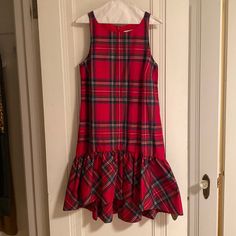 Vineyard Vines Jolly Plaid Amelia Swing Dress. Size 6. Sleeveless, Lined, Hidden Zipper In The Back. 98% Polyester, 2% Silk. Sleeveless Plaid Dress With Ruffle Hem, Plaid Sleeveless Dress With Ruffle Hem, Sleeveless Ruffled Mini Dress For Holiday, Plaid Sleeveless Lined Dress, Casual Sleeveless Mini Dress For Holiday, Red Sleeveless Mini Dress For Holiday, Plaid Summer Holiday Dress, Red Sleeveless Mini Dress For Daywear, Size 6 Dress