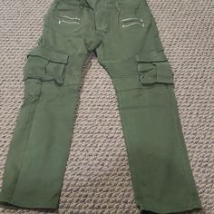 Army Green Cargo Pants. Measurements Are On The Listing Pictures. 38" Long. Unisex Casual Green Jeans With Multiple Pockets, Urban Green Jeans With Pockets, Green Jeans With Multiple Pockets For Streetwear, Green Jeans With Side Pockets For Streetwear, Green Utility Jeans With Multiple Pockets, Urban Green Cargo Jeans With Hip Pockets, Urban Stretch Jeans With Pockets, Stretch Cargo Jeans With Side Pockets For Streetwear, Green Straight Leg Cargo Pants With Hip Pockets