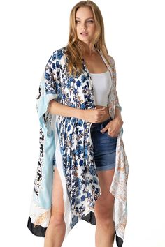 Boho print kimono with contrasting prints. Ultra light, draping open-front. Light and billowy silhouette, perfect for effortless layering. CARE | Hand Wash Cold or Dry Clean CONTENTS | 100% Viscose MEASUREMENTS | 36"/91 cm Top to Bottom (Size O/S) MODEL | 5'8 - wearing O/S IMPORTED Print Kimonos, Boho Print, Swimwear Cover Ups, Swimwear Fashion, S Models, Front Open, Layering, Cover Up, Dry Clean