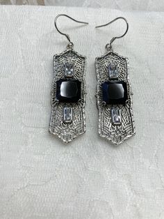 "Black Cubic Zirconia Earrings Square Peg Design#E63 Custom Made About 12 months ago I found a lovely Art Deco brooch and fell in love with the design. Fashioned in the design of the brooch, I now offer these lovely Antique reproduction earrings in sterling silver (matching pendant also available for sale in my store). The 3ct simulated black cubic zirconia gemstone is 10mm in L & W (3/8th\"). The 2 baguette CZ gems are 6mm x 3mm. The pendant is 1 3/4 inches long, it is just shy of 5/8th\" a Evening Jewelry In Sterling Silver With Intricate Design, Silver Filigree Jewelry For Evening, Sterling Silver Filigree Jewelry For Party, Pierced Sterling Silver Jewelry For Evening, Black Filigree Earrings, Nickel-free Silver Jewelry For Evening, Art Deco Silver Earrings With Cubic Zirconia, Elegant Formal Earrings Stamped 925, Art Deco Cubic Zirconia Earrings Gift