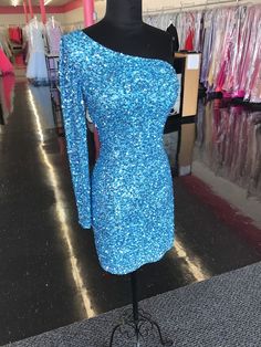 Ashley Lauren 4457 Cocktail Dress.  This is a perfect homecoming or pageant dress One-shoulder Sequin Homecoming Dress, One Shoulder Evening Dress For Homecoming, Sequin Dresses For Prom Season Pageants, Embellished Sequin Dress For Prom Season Pageant, Sequin Pageant Dress For Prom Season, Embellished Sequin Dress For Pageant During Prom Season, Embellished Sequin Dress For Prom And Pageants, Embellished Sequin Dress For Prom Pageant, Blue One Shoulder Dress For Prom