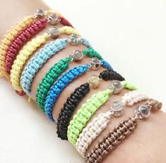 multicolored bracelets with buttons on the wrist