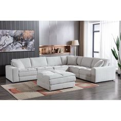 a living room with a large white sectional couch