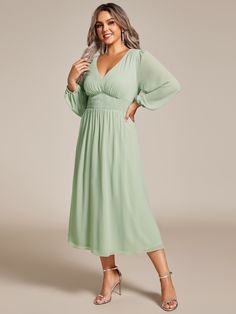 Step into any wedding celebration with confidence in our Plus Size Flowy Long Sleeves V-Neck Midi Chiffon Wedding Guest Dress. The airy chiffon fabric drapes beautifully around your curves, offering a flattering and effortless look. With its versatile midi length and long sleeves, this dress fits perfectly into any evening affair. Whether it's a grand ballroom reception or an intimate candlelit dinner, you'll feel like the belle of the ball, radiating elegance and charm in this captivating ensemble. Flowy Chiffon V-neck Dress For Wedding Guests, Green Chiffon Wedding Dress, Chiffon Wedding Dress With Ruched Bodice, Flowy Chiffon Dress With Ruched Bodice For Weddings, Flowy Green Chiffon Dress For Wedding, Ruched Chiffon Bridesmaid Dress, Spring Wedding Chiffon V-neck Dress, Elegant Green Chiffon Dress For Wedding, Spring Wedding Chiffon Bridesmaid Dress