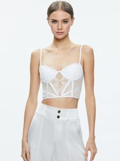 We've got a thing for bustiers (can't you tell?) and we love the cropped fit and lace construction of this one. It has old school lingerie vibes that look great peeking out from under a blazer or layered. Lace Bustier Top, Lace Bustier, Alice And Olivia, Exposed Zipper, Bustier Top, Alice Olivia, A Thing, Old School, Looks Great