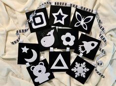 black and white paper cut outs with animals, stars, and other things on them