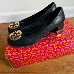 Black/Gold. 2” Inch Stack Heel Pump. Metal Logo With Soft Leather. Round Toe, Signature Emblem At Toe. Leather Upper And Lining New Condition (Worn Few Times), Comes With Original Shoe Box Size: 6.5 Us Women Shipping Items Will Be Shipped Out 1 Business Day After Payment Is Made **Feel Free To Ask Questions Metal Logo, Metallic Logo, Tory Burch Shoes, Stacked Heel, Shoe Box, Shoes Women Heels, Soft Leather, Tory Burch, Leather Upper